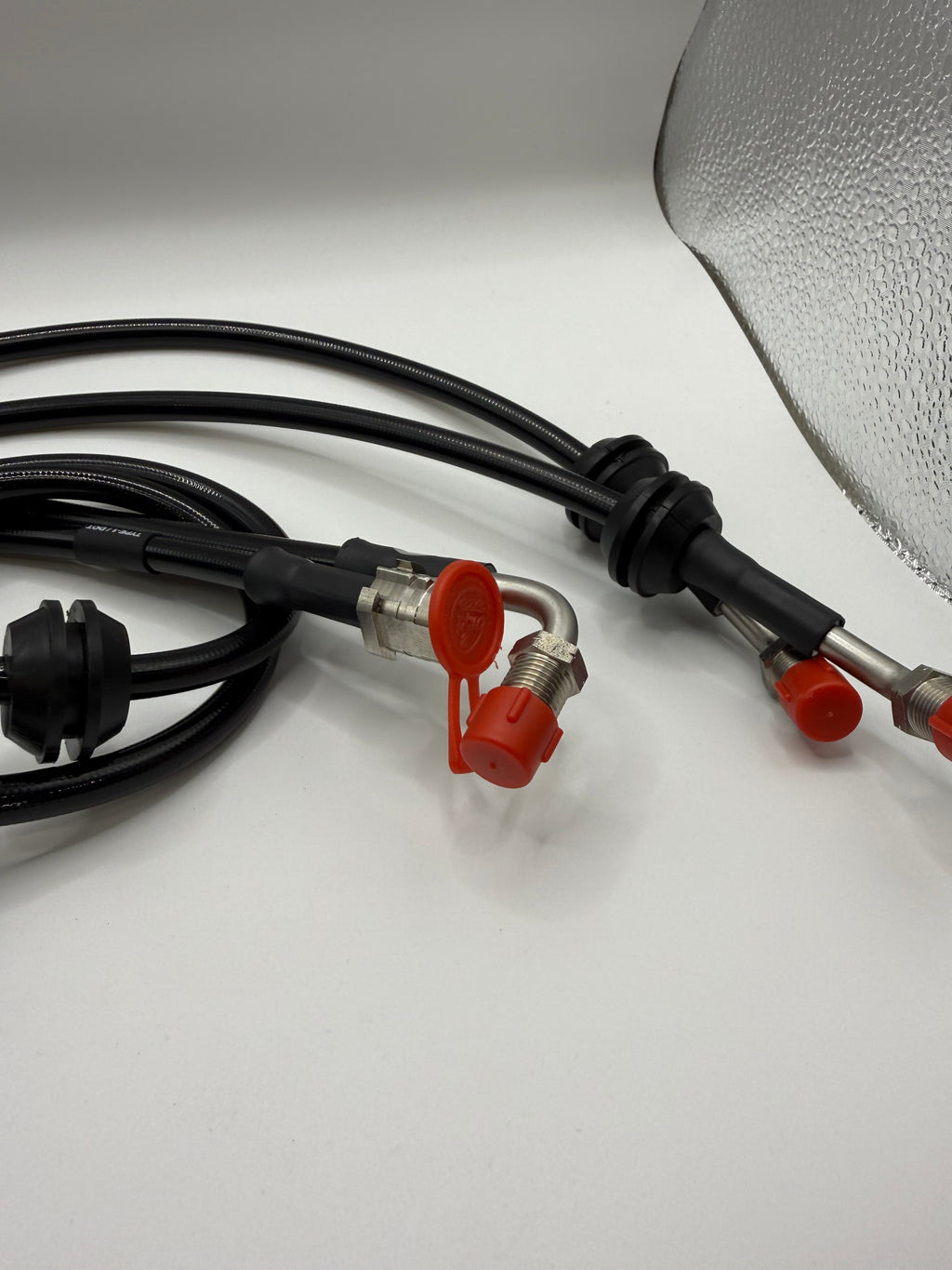 Eastwood Engineering valve controller hose kit with connectors and protective caps on white background