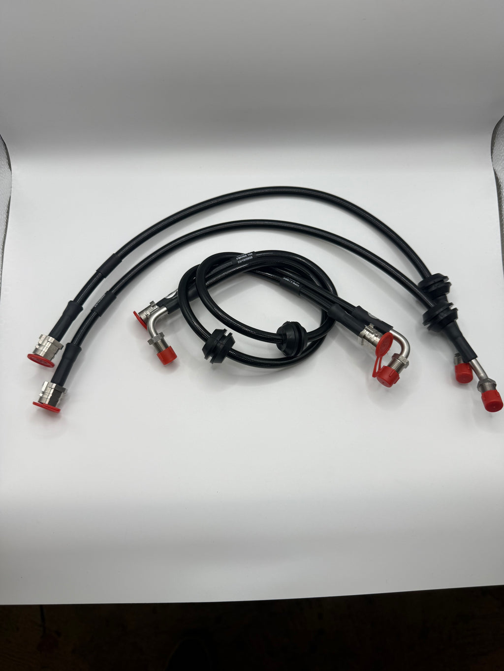 Black valve controller cables with silver connectors and red caps on white background, Eastwood Engineering UK performance parts